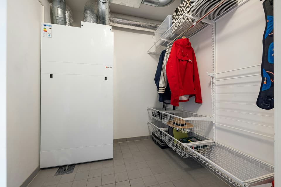 A white indoor ventilation unit in a utility room